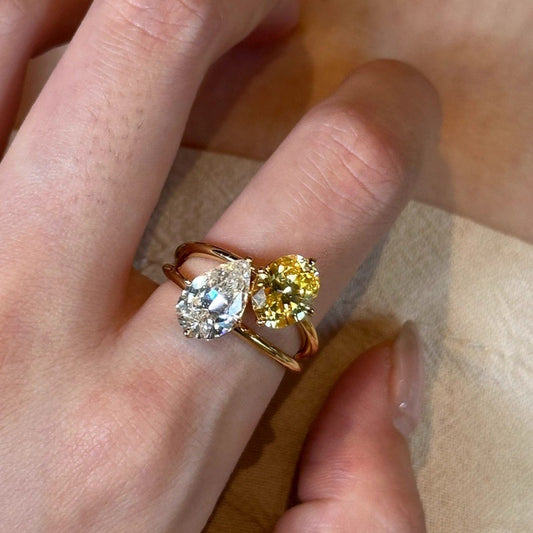 Dazzling Toi et Moi Open Ring featuring a Pear-cut Clear Zircon and Oval Orange Cubic Zirconia in 14K Gold Plated Band