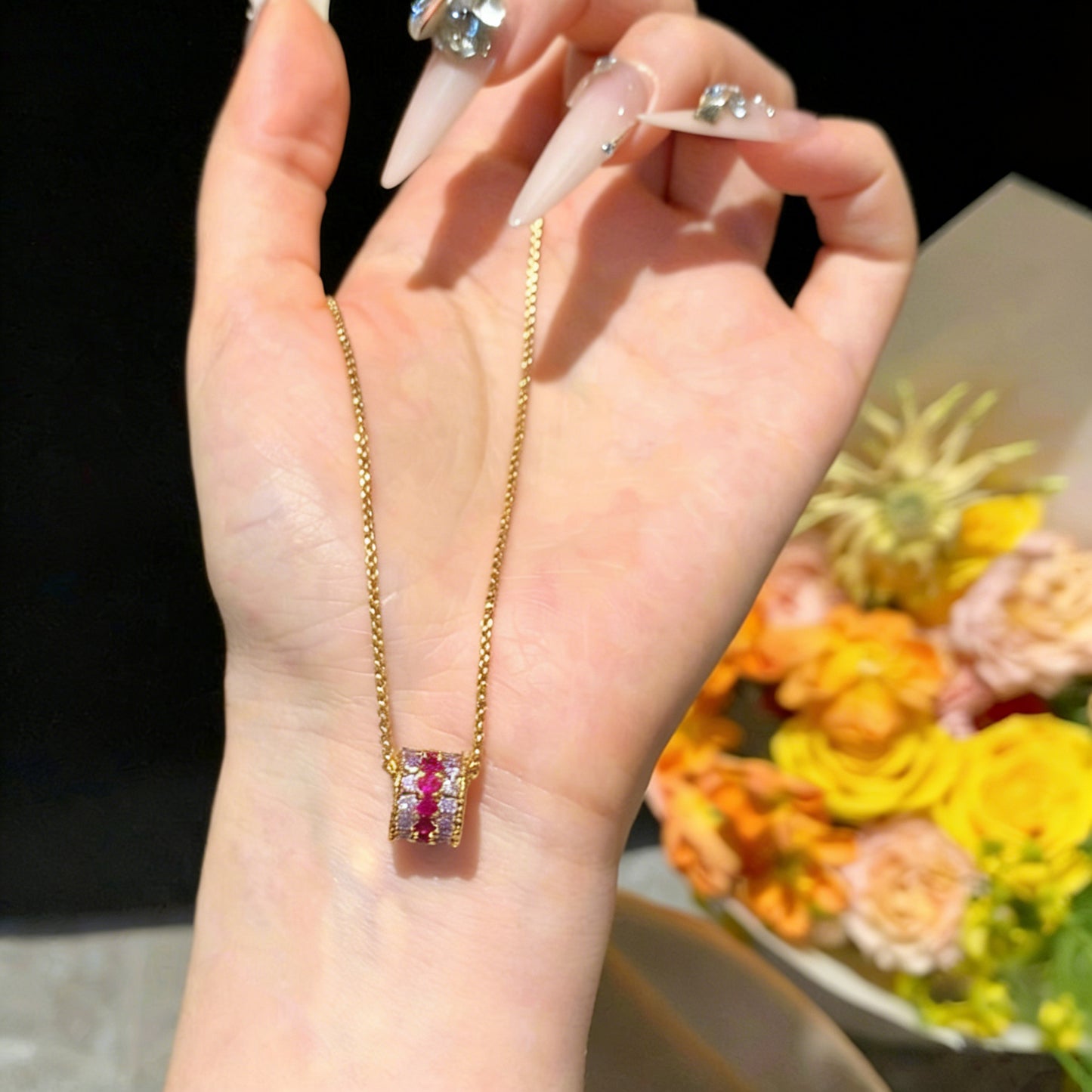 18K gold plated cylinder pendant necklace encrusted with shimmering cubic zirconia stones for a modern look