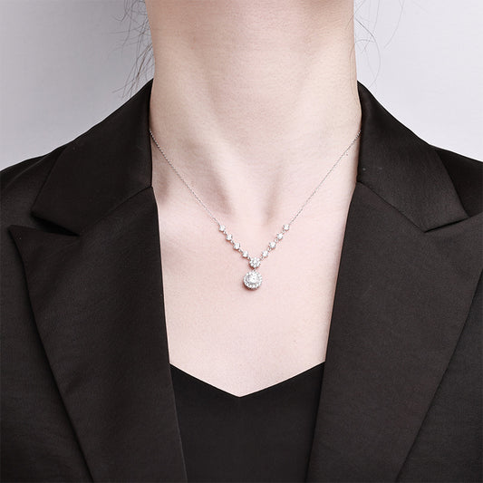 Sparkling S925 sterling silver necklace featuring a 1ct round moissanite centerpiece with a brilliant halo of accent stones