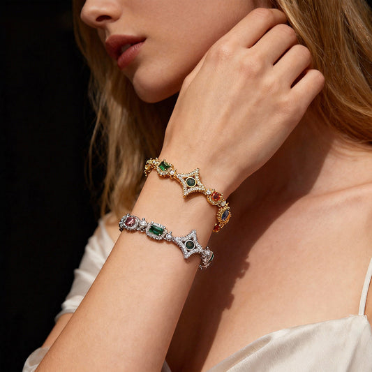 Elegant necklace featuring a vibrant multicolor gemstone pendant on a classic chain, available in gold and silver finishes