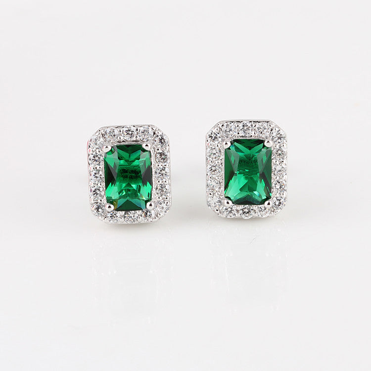 Square emerald green stud earrings with a sparkling zirconia halo pave, crafted in polished S925 sterling silver