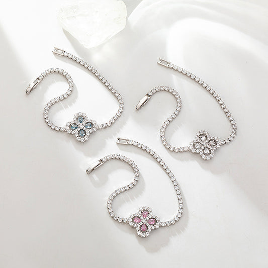 S925 sterling silver tennis bracelet with a four-leaf clover halo charm featuring sparkling cubic zirconia