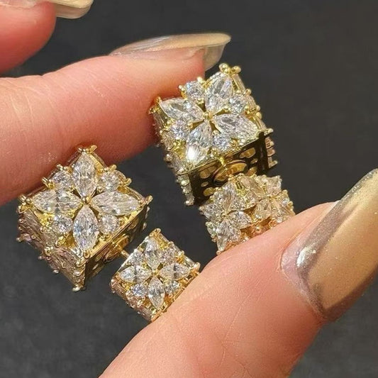 Minimalist S925 silver cube stud earrings featuring a sparkling central zirconia, available in gold and silver