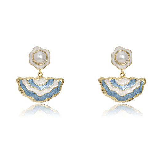 Gold S925 silver drop earrings featuring blue enamel studs and elegant dangling white pearls with a handmade finish