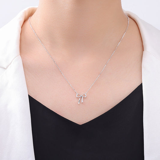 Minimalist S925 sterling silver bowknot pendant necklace featuring a delicate ribbon design for a romantic look
