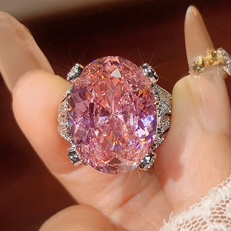 Romantic silver Open Ring featuring a Vibrant Pink Cubic Zirconia Stone and Sparkling Twisted Rope Band Design