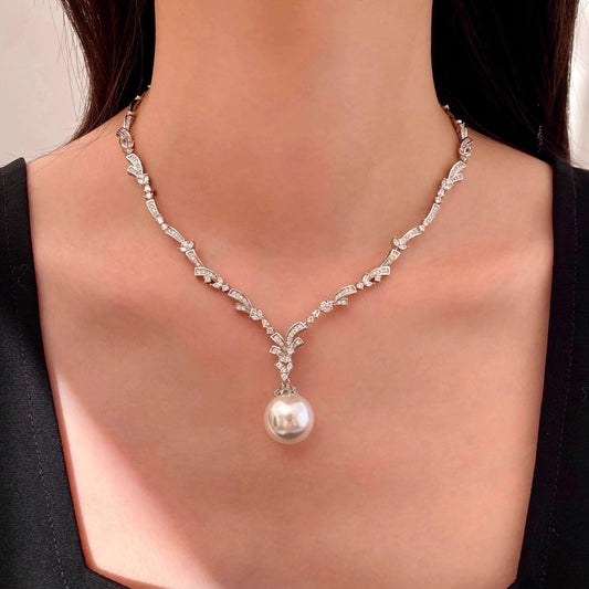 Elegant Y-shaped lariat necklace featuring a delicate pearl and sparkling cubic zirconia pendant