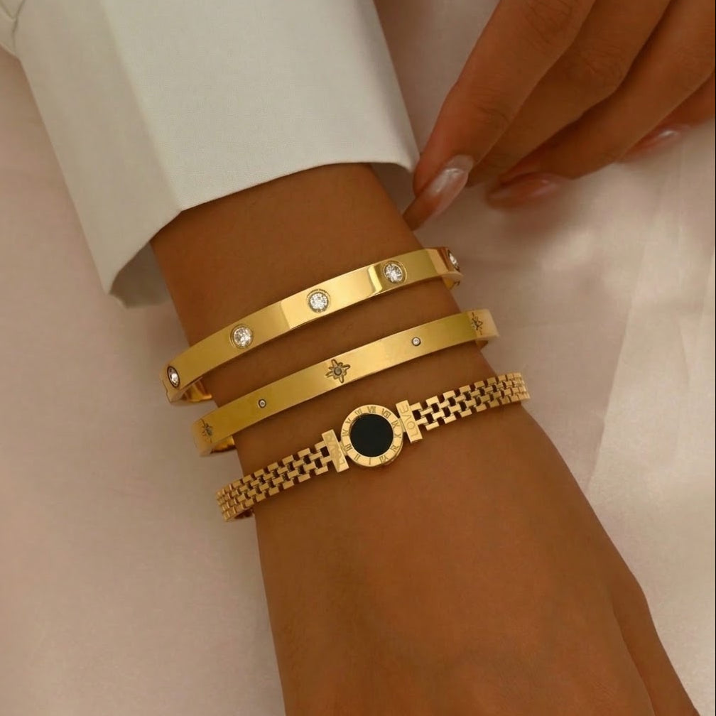 Round disc shell inlay and watch-band link mesh style stainless steel jewelry bangle in waterproof 18k gold plated finish.