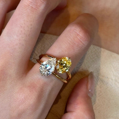 Dazzling Toi et Moi Open Ring featuring a Pear-cut Clear Zircon and Oval Orange Cubic Zirconia in 14K Gold Plated Band