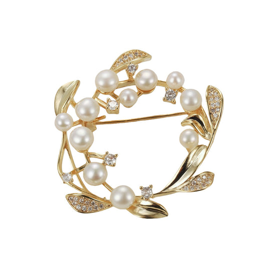 Elegant 18K gold plated wreath brooch with shimmering white zirconia leaves and lustrous pearls
