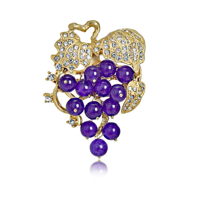 Elegant 18K gold plated grape brooch featuring mint green and purple cubic zirconia stones in a fruit-themed design