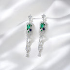 Elegant long tassel drop earrings with 18K white gold plating. Sleek vertical silver-tone linear design