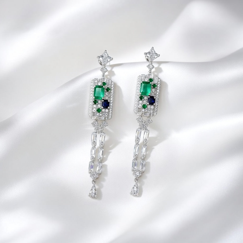 Elegant long tassel drop earrings with 18K white gold plating. Sleek vertical silver-tone linear design