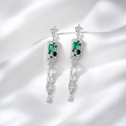 Elegant long tassel drop earrings with 18K white gold plating. Sleek vertical silver-tone linear design