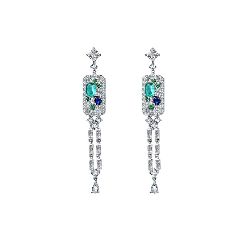 Elegant long tassel drop earrings with 18K white gold plating. Sleek vertical silver-tone linear design