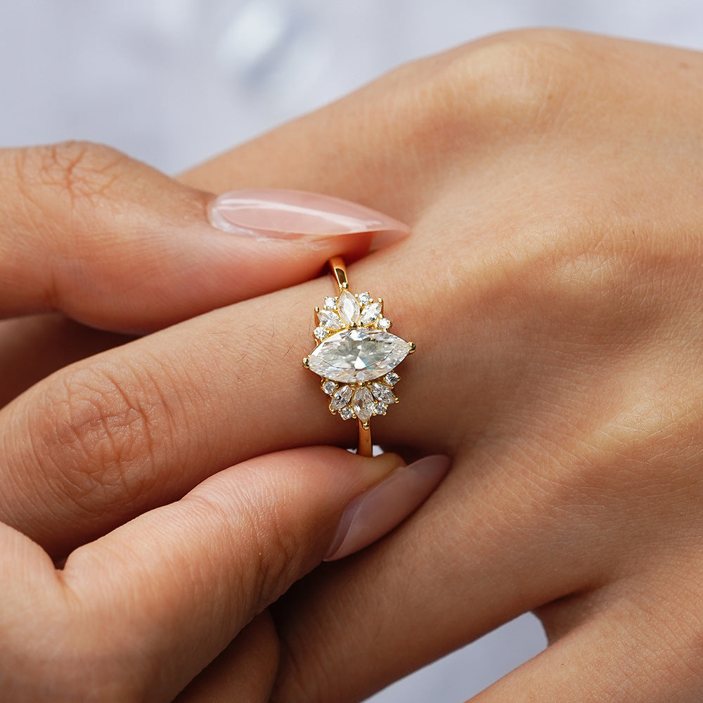 Elegant 1ct Marquise Cut Moissanite Solitaire Ring with a Polished Gold Band and Classic Prong Setting