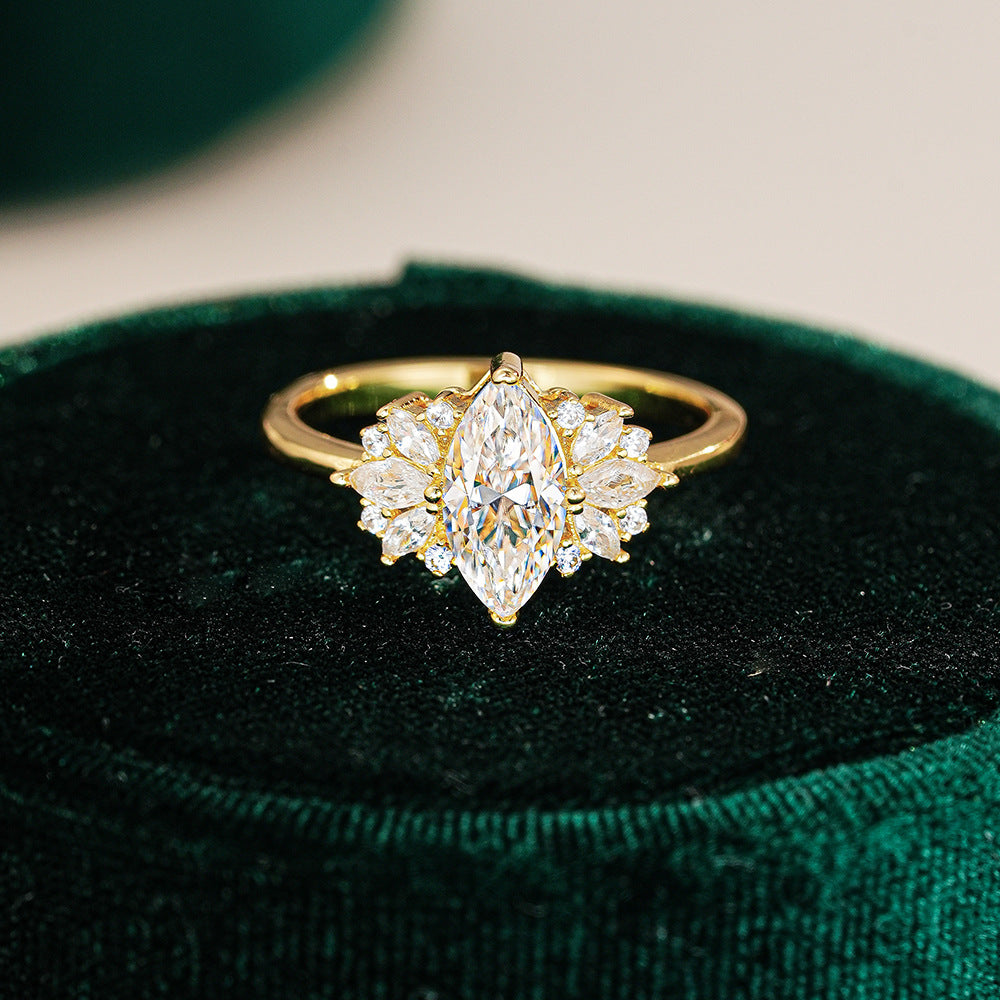 Elegant 1ct Marquise Cut Moissanite Solitaire Ring with a Polished Gold Band and Classic Prong Setting