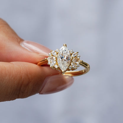 Elegant 1ct Marquise Cut Moissanite Solitaire Ring with a Polished Gold Band and Classic Prong Setting