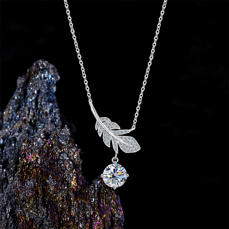 Elegant S925 sterling silver necklace featuring a delicate feather pendant with a brilliant 1ct moissanite stone and GRA certification