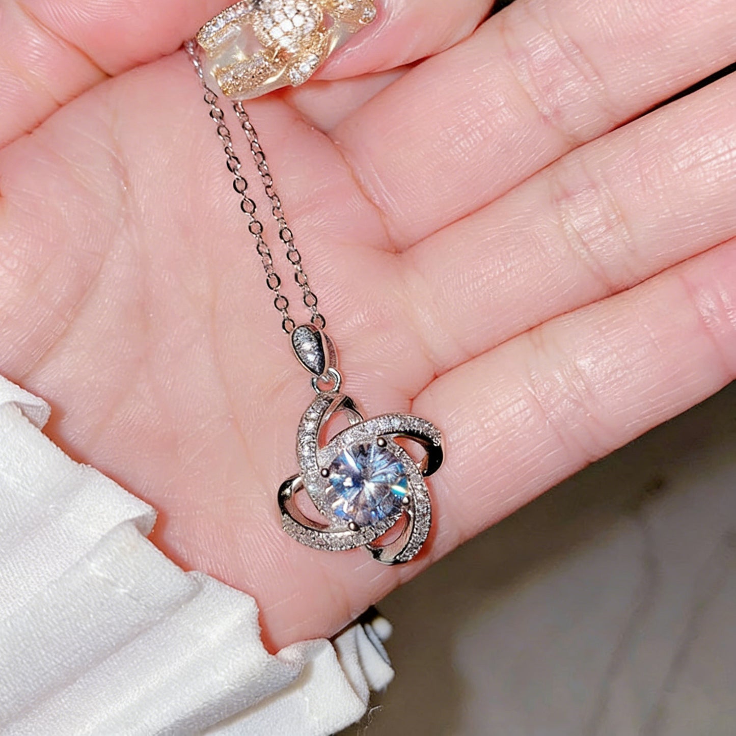 S925 silver necklace featuring a 1ct round moissanite with an infinity halo design and GRA certificate