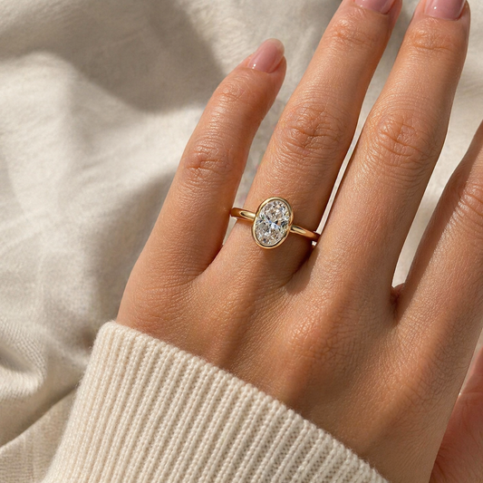 2 carat oval cut moissanite ring with a modern half-bezel setting in 18K gold plated S925 sterling silver