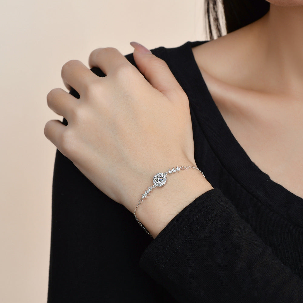 Elegant S925 sterling silver bracelet featuring a brilliant moissanite center stone with a sparkling halo setting