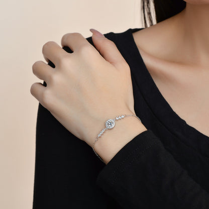Elegant S925 sterling silver bracelet featuring a brilliant moissanite center stone with a sparkling halo setting
