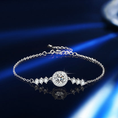 Elegant S925 sterling silver bracelet featuring a brilliant moissanite center stone with a sparkling halo setting