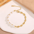 Baroque pearl bead strand and mariner puff bean chain stainless steel jewelry bracelet in waterproof 18k gold plated finish.