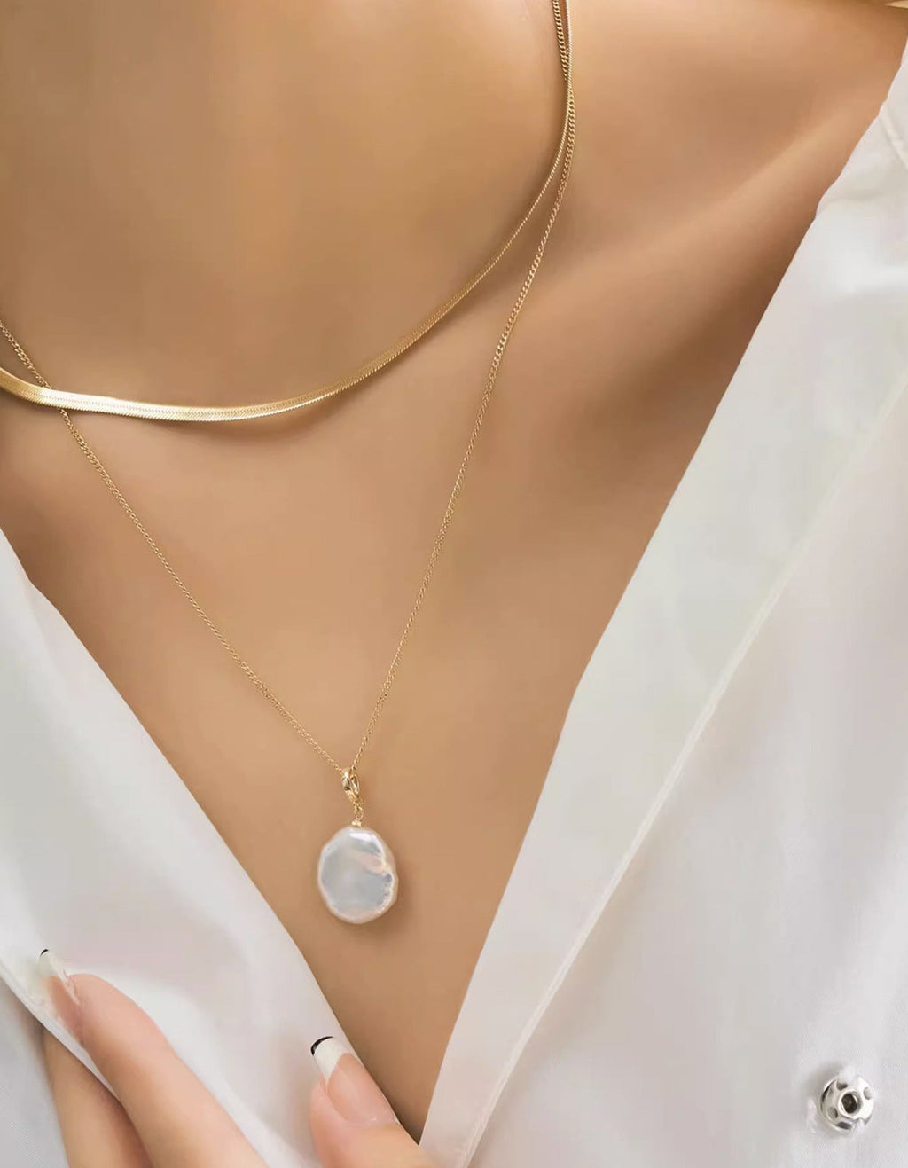 Natural baroque pearl pendant cable chain and flat herringbone chain layered necklace in gold plated titanium steel jewelry.