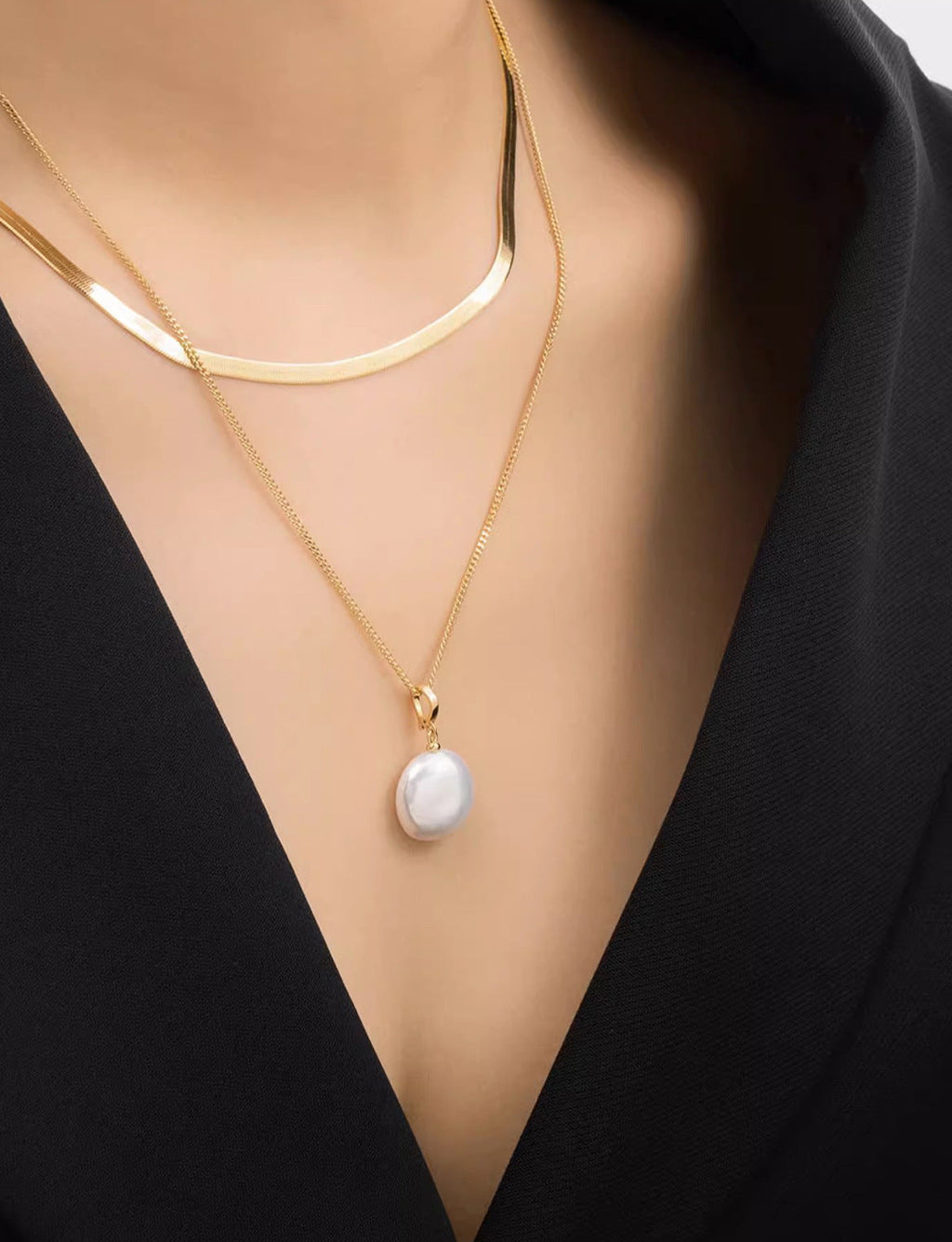 Natural baroque pearl pendant cable chain and flat herringbone chain layered necklace in gold plated titanium steel jewelry.
