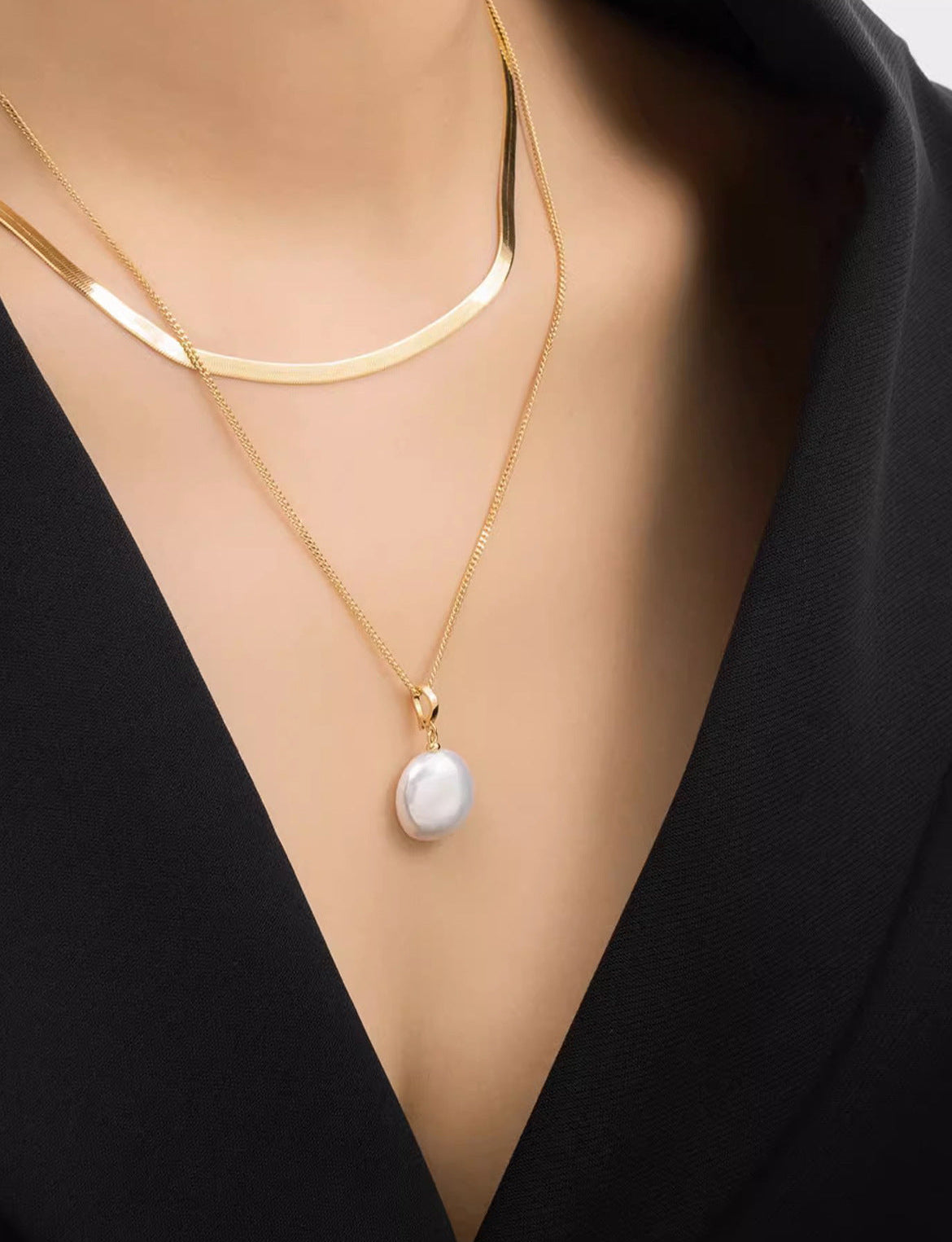 Natural baroque pearl pendant cable chain and flat herringbone chain layered necklace in gold plated titanium steel jewelry.