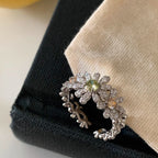 Pave pave cubic zirconia micro cz crystal blooming daisy floral cluster and olive green champagne colored stones open cuff adjustable ring stainless steel jewelry in waterproof finish.