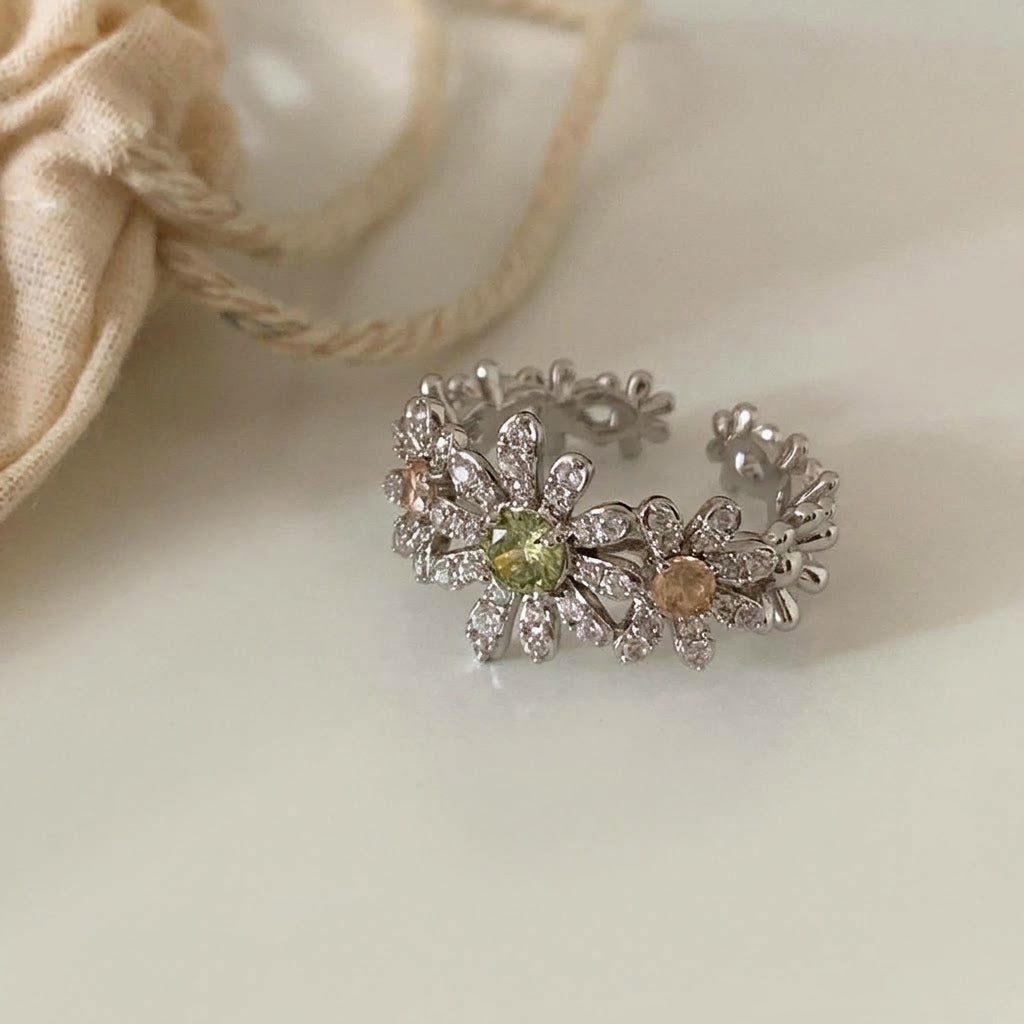 Pave pave cubic zirconia micro cz crystal blooming daisy floral cluster and olive green champagne colored stones open cuff adjustable ring stainless steel jewelry in waterproof finish.