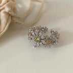 Pave pave cubic zirconia micro cz crystal blooming daisy floral cluster and olive green champagne colored stones open cuff adjustable ring stainless steel jewelry in waterproof finish.