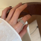 Pave pave cubic zirconia micro cz crystal blooming daisy floral cluster and olive green champagne colored stones open cuff adjustable ring stainless steel jewelry in waterproof finish.