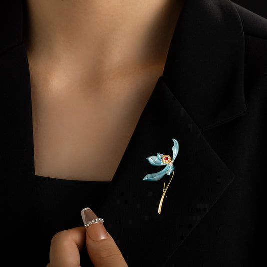 Artistic blue iris brooch with hand-painted enamel petals and a lustrous white pearl center