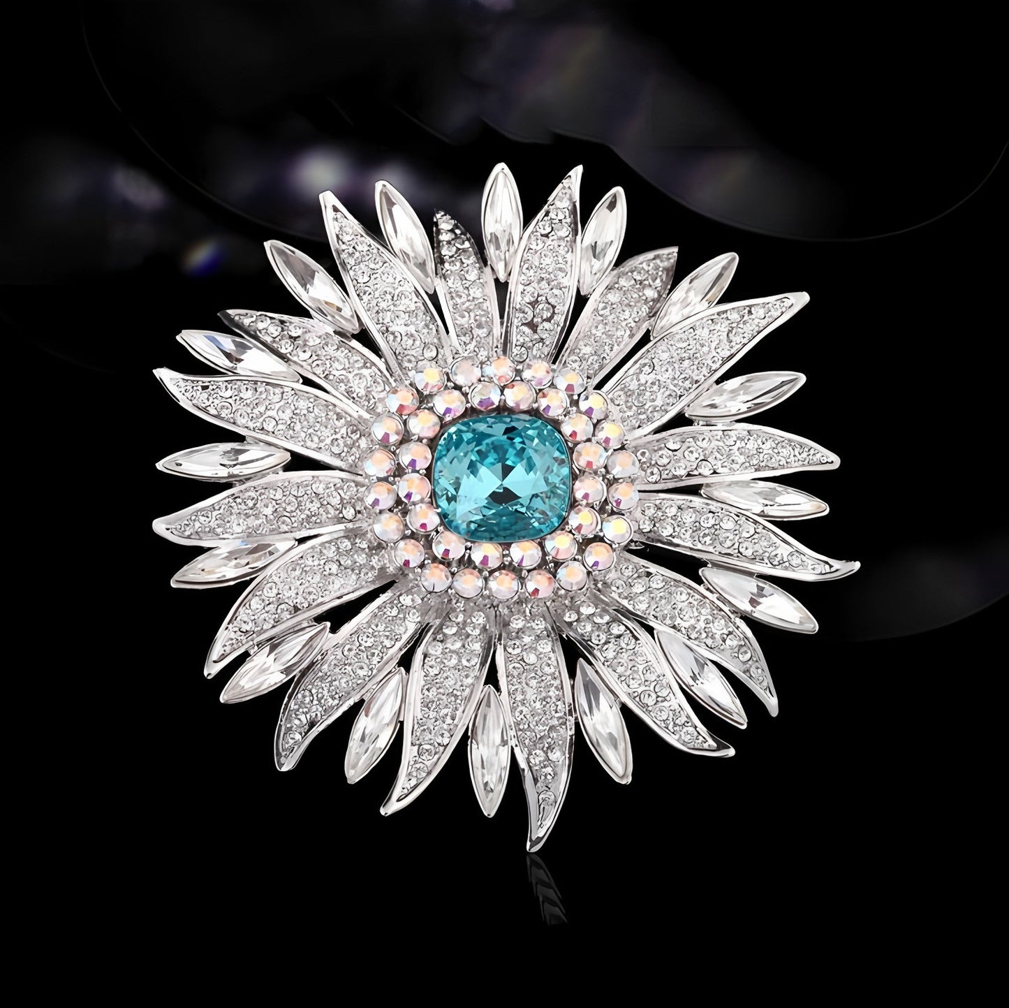 Elegant wheat ear brooch featuring light blue and white cubic zirconia stones in an 18K white gold plated setting