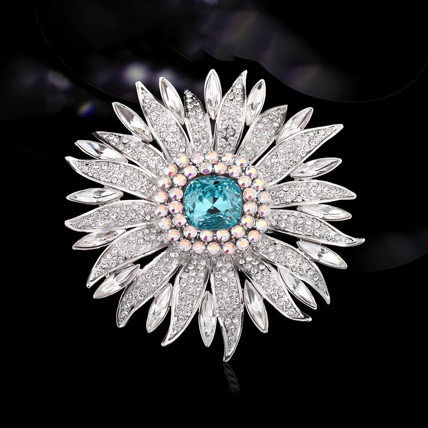 Elegant wheat ear brooch featuring light blue and white cubic zirconia stones in an 18K white gold plated setting