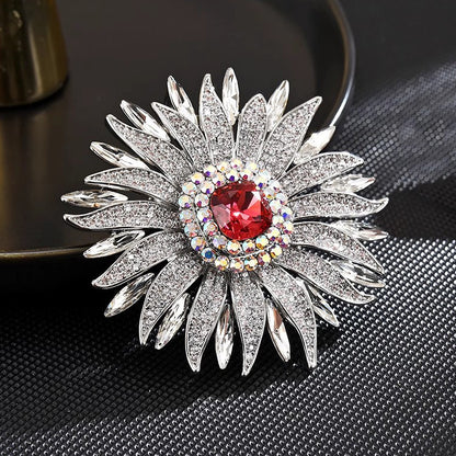 Elegant wheat ear brooch featuring light blue and white cubic zirconia stones in an 18K white gold plated setting