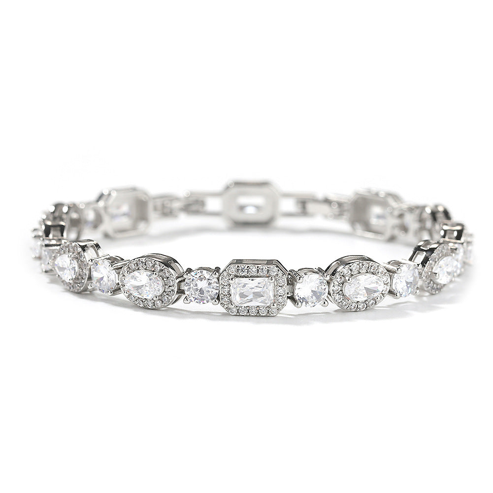 Elegant bypass wrap bracelet with sparkling zirconia halo charms, available in gold, silver, and rose gold
