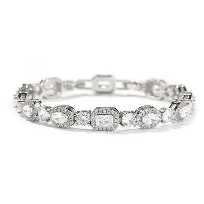 Elegant bypass wrap bracelet with sparkling zirconia halo charms, available in gold, silver, and rose gold