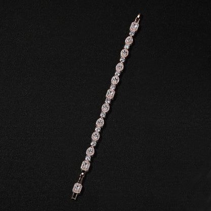 Elegant bypass wrap bracelet with sparkling zirconia halo charms, available in gold, silver, and rose gold