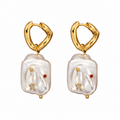 Natural Stainless steel jewelry baroque pearl huggie drop earrings inlaid with gold starburst cz crystal and ruby red stone accents.