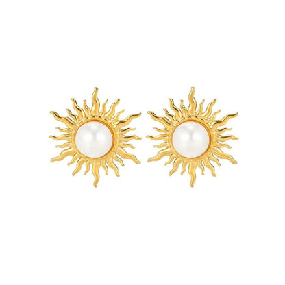 Paired vintage-style gold sunburst stud earrings featuring a central lustrous white pearl