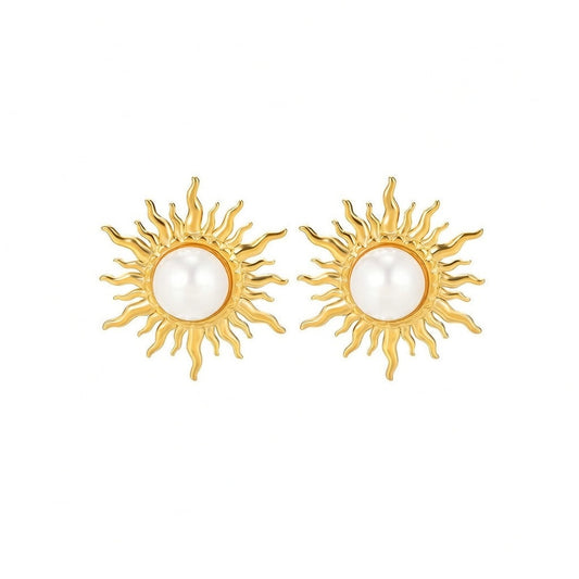 Paired vintage-style gold sunburst stud earrings featuring a central lustrous white pearl