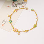 Colorful  Stainless steel jewelry enamel double-sided dopamine bracelet with pastel flower and heart charms on a gold paperclip chain.