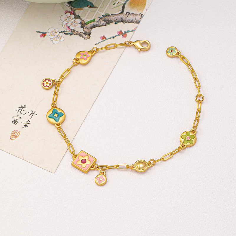 Colorful  Stainless steel jewelry enamel double-sided dopamine bracelet with pastel flower and heart charms on a gold paperclip chain.