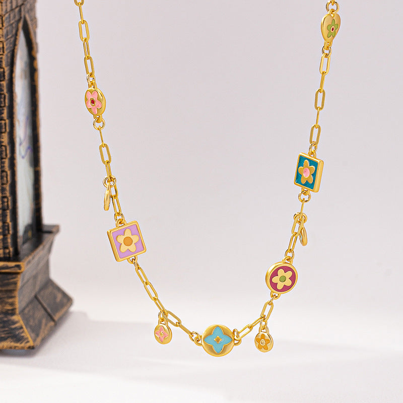 Colorful Stainless steel jewelry enamel double-sided dopamine necklace with pastel flowers and starburst stations on paperclip chain.