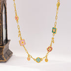 Colorful Stainless steel jewelry enamel double-sided dopamine necklace with pastel flowers and starburst stations on paperclip chain.